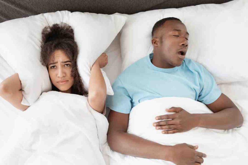 snoring-man-sleeping-with-apnea-and-sleepless-woman-angry-wife-unable-to-get-to-sleep